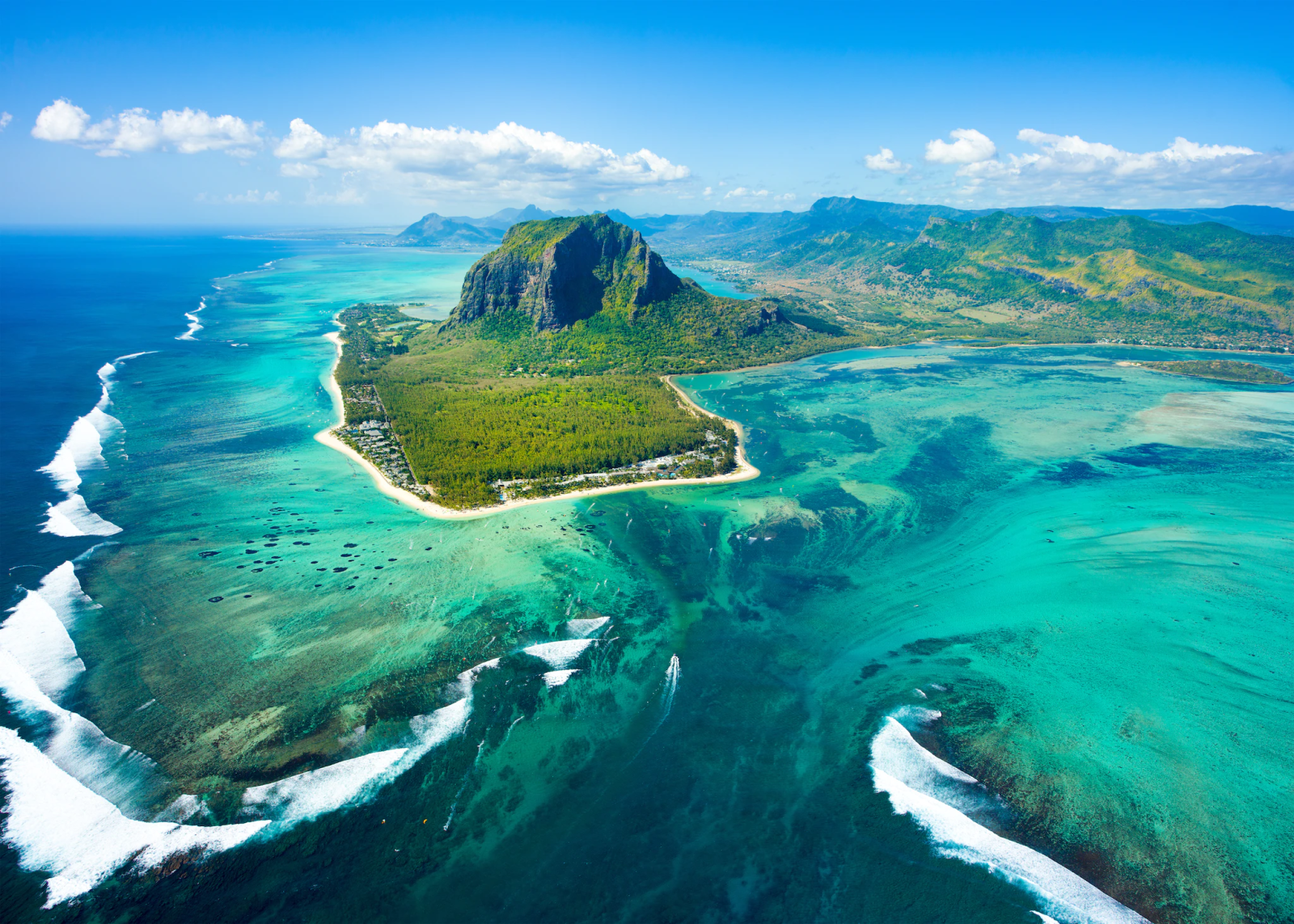 Boat cruising to coastline of a Mauritius in the Indian Ocean