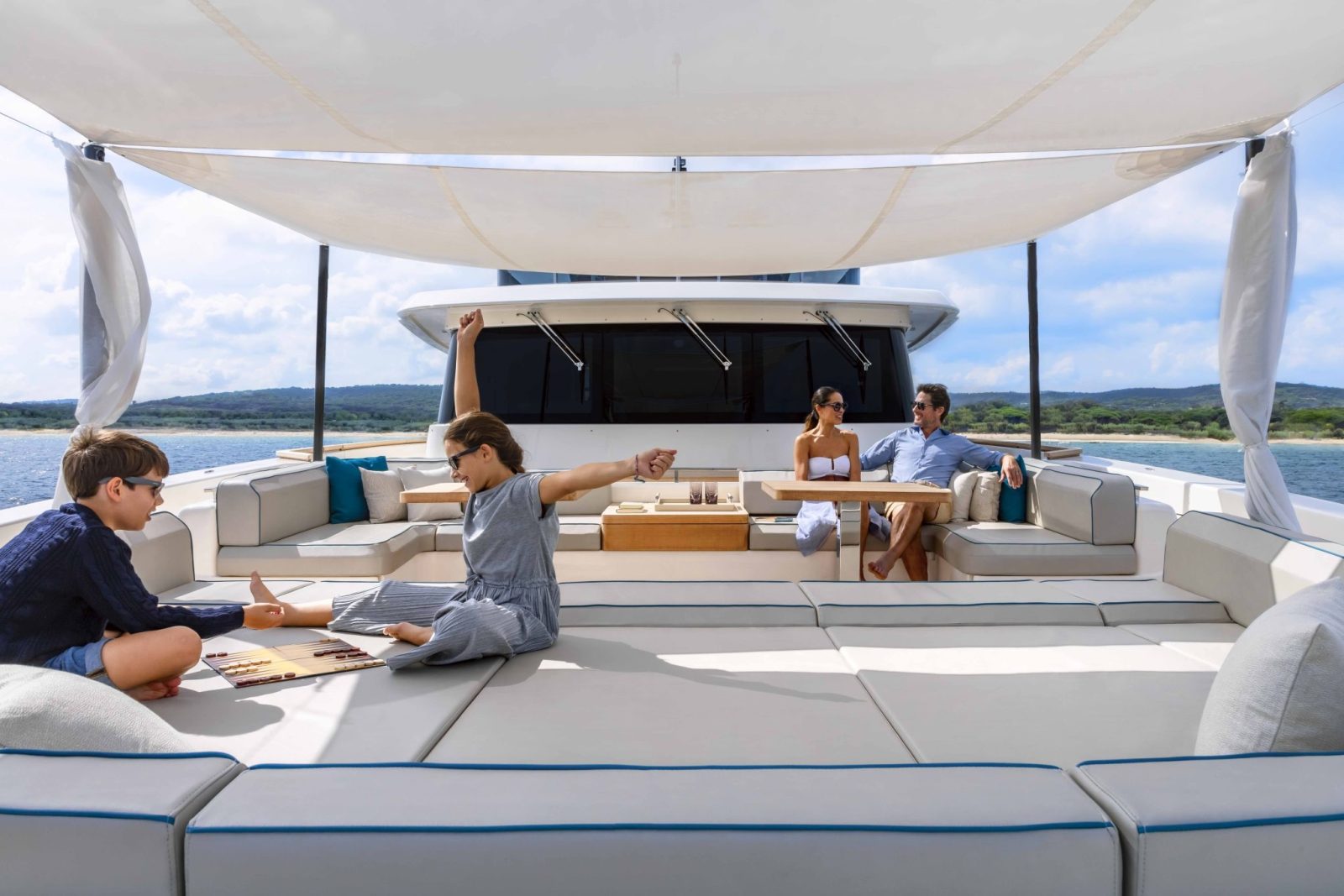 Family enjoying a yacht charter vacation on a Custom Line Navetta 42 superyacht.