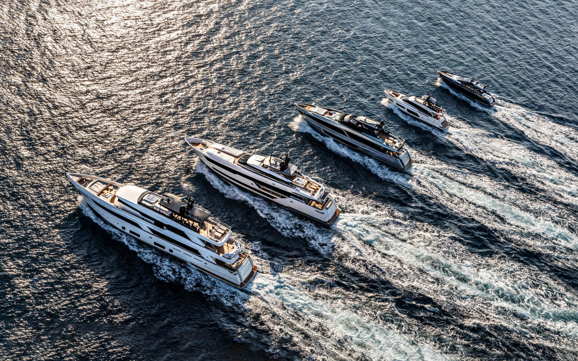 riva-yacht-fleet-running-on-sea1