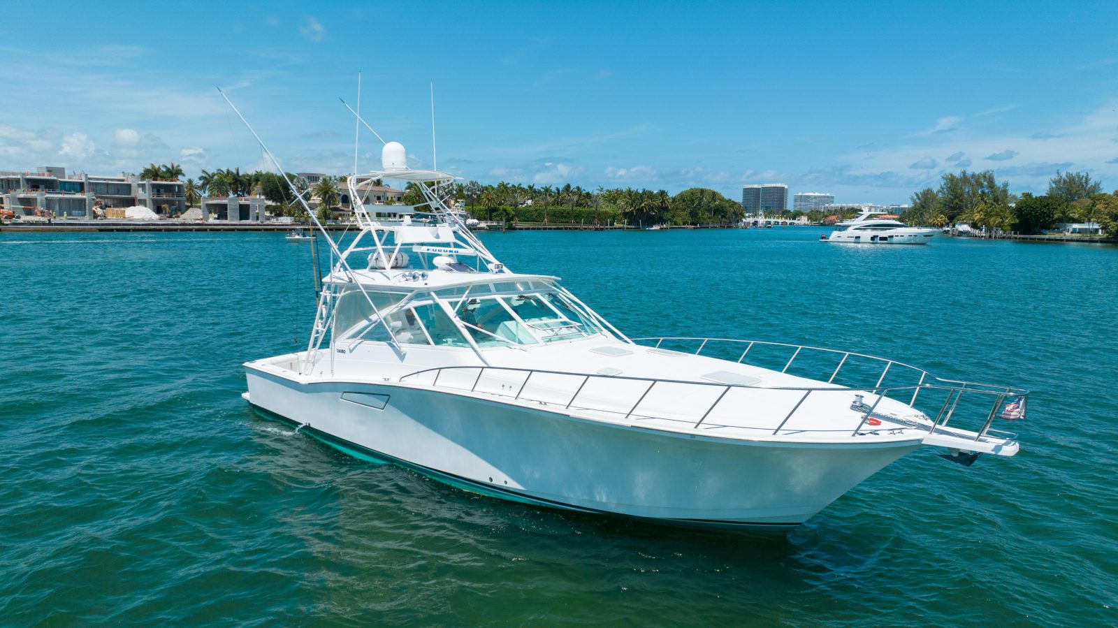 Cabo Yacht Sportfishing boat cruising the intercoastal waterways on a sunny, cloudless day.