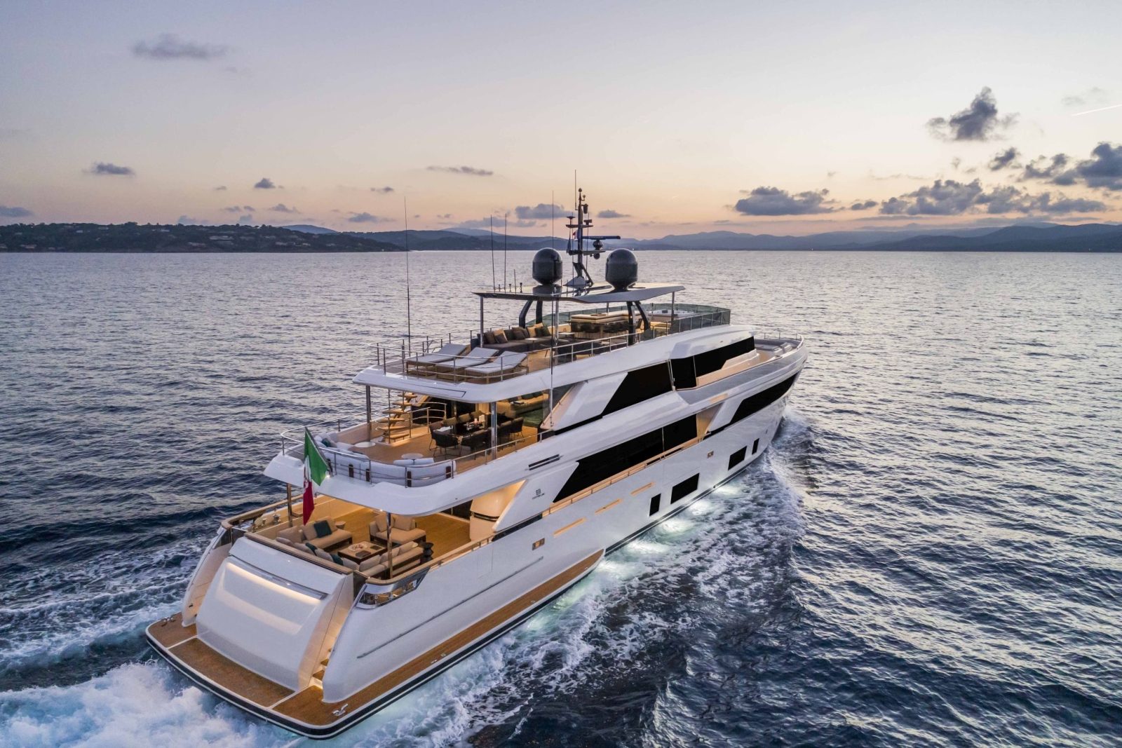 Custom Line Navetta 42 cruising the open waters during sunset.